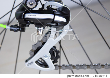 Close-up of bicycle gears and mountain bike chains. Reverse gear shifting Close-up of bicycle gears and mountain bike chains. Reverse gear shifting 71638951