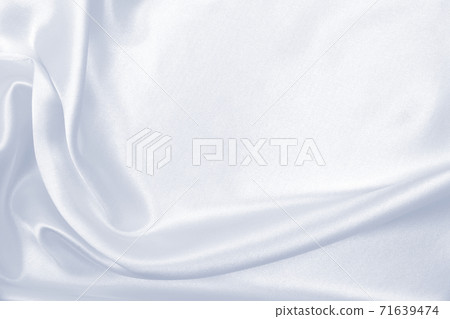 Smooth elegant grey silk or satin luxury cloth as wedding background. Luxurious background design Smooth elegant grey silk or satin luxury cloth as wedding background. Luxurious background design 71639474