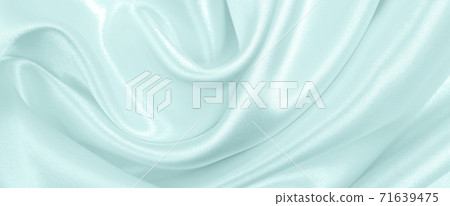 Smooth elegant blue silk or satin luxury cloth texture as abstract background. Luxurious background design Smooth elegant blue silk or satin luxury cloth texture as abstract background. Luxurious background design 71639475