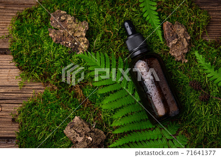 Natural cosmetic concept with glass bottle 71641377