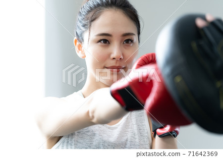 A young woman doing a boxer A young woman doing a boxer 71642369