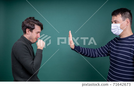 man in mask fencing off coughing guy 71642673