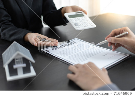 Real estate broker has given the house to customers who bought the house with insurance, Negotiating purchase-sale and investment planning concept. 71646969