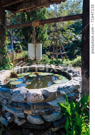 Image of Iron bucket with water well Image of Iron bucket with water well 71647138