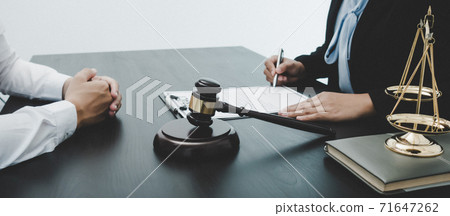 Lawyer or counselor works in the courtroom and negotiates with clients or complainants seeking justice on land encroachment, Law that validity and justice concept. Lawyer or counselor works in the courtroom and negotiates with clients or complainants seeking justice on land encroachment, Law that validity and justice concept. 71647262
