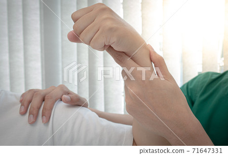 Professional therapists are stretching muscles, patients with abnormal muscular symptoms, physical rehabilitation therapies and treatment of physiological disorders by physiotherapists concept. Professional therapists are stretching muscles, patients with abnormal muscular symptoms, physical rehabilitation therapies and treatment of physiological disorders by physiotherapists concept. 71647331