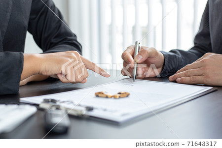 Car dealers or managers have offered special prices and conditions for car purchases with insurance. Service and offering or financial banking concept. 71648317