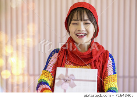 Girl with Christmas gifts Girl with Christmas gifts 71648403