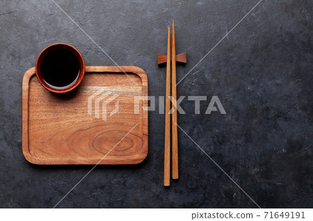 Wooden plate and chopsticks for your sushi and maki Wooden plate and chopsticks for your sushi and maki 71649191