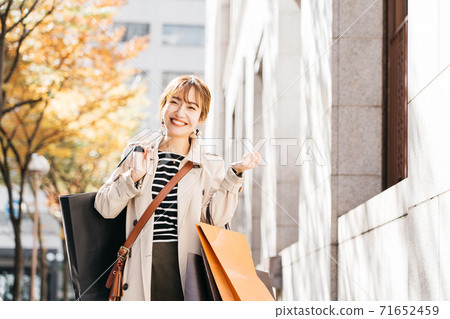 Young women shopping 71652459