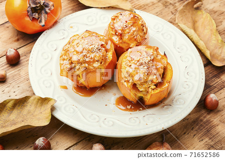 Baked stuffed persimmon 71652586