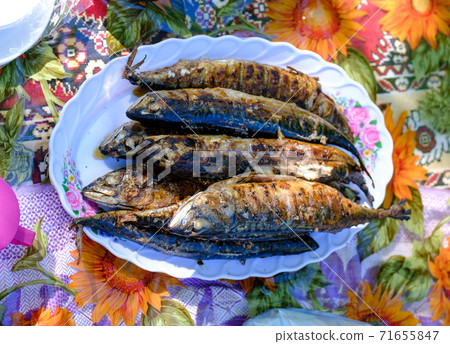 grilled spicy mackerel fish on a dish. top view. grilled fish grilled spicy mackerel fish on a dish. top view. grilled fish 71655847