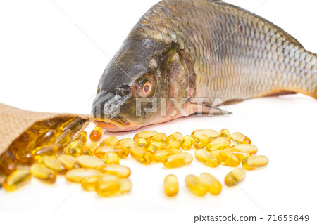 Omega 3 capsules and fresh fish Omega 3 capsules and fresh fish 71655849