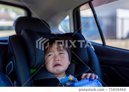 Boy sitting on the junior seat Boy sitting on the junior seat 71656468