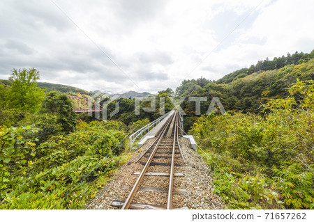 Looking back at the railway bridge from inside the Aizu Railway train Looking back at the railway bridge from inside the Aizu Railway train 71657262