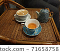 Neatly prepared tea cups and kettles 71658758