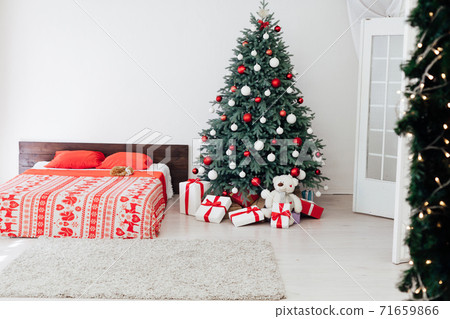 Christmas tree with gift decor bedroom with bed new year feast winter background Christmas tree with gift decor bedroom with bed new year feast winter background 71659866