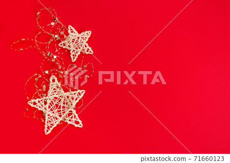 Beautiful Christmas and New Year composition with white Christmas stars on red background. Festive backdrop with copyspace for your project or greeting card 71660123