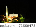 Pink Christmas decorations with candlels on a black background 71660478