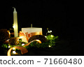 Pink Christmas decorations with candlels on a black background 71660480