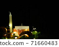 Pink Christmas decorations with candlels on a black background 71660483