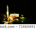 Pink Christmas decorations with candlels on a black background 71660491