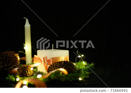 Pink Christmas decorations with candlels on a black background 71660491