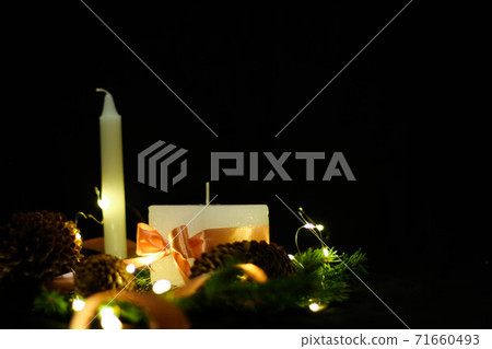 Pink Christmas decorations with candlels on a black background 71660493