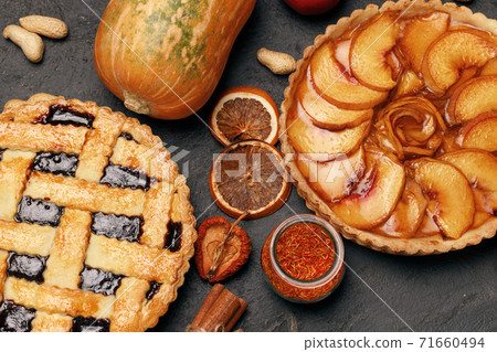 Berry tart pie and apple tart pie on black background 71660494