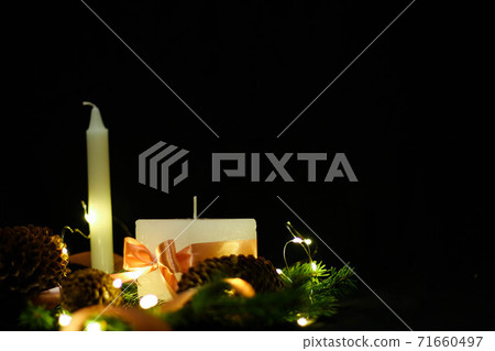 Pink Christmas decorations with candlels on a black background 71660497