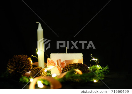 Pink Christmas decorations with candlels on a black background 71660499
