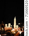Pink Christmas decorations with candlels on a black background 71660520