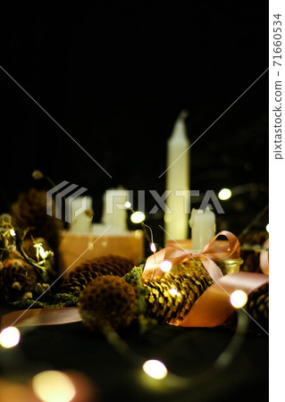 Pink Christmas decorations with candlels on a black background 71660534