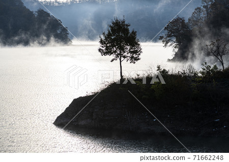 Morning by the river in the mist 71662248