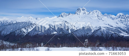 Panoramic view on high snowy mountains in winter at sunny day. Caucasus Mountains, Mount Ushba. Svaneti region of Georgia 71663053