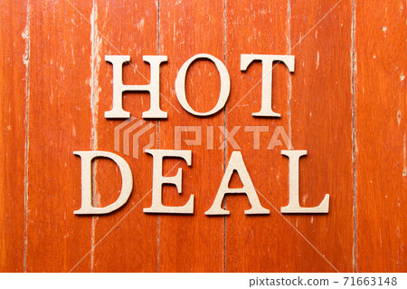 Alphabet letter in word hot deal on old red color wood plate background 71663148