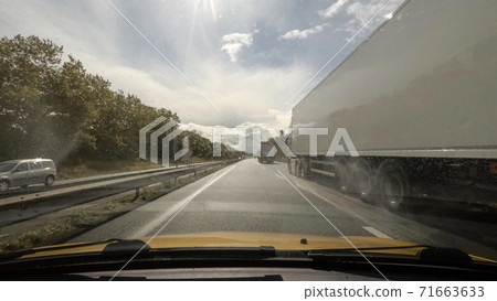 Driving on highway point of view 71663633