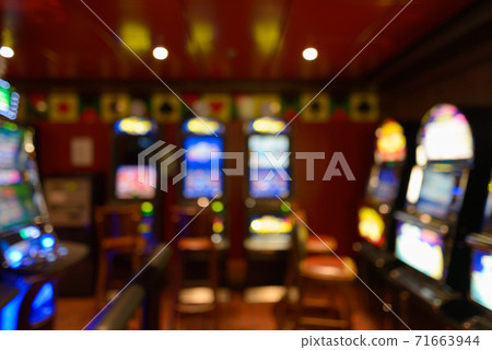 Blurred colorful lights and slot machines at the casino 71663944