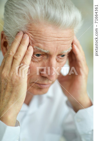 Close-up portrait of sad thinking senior man Close-up portrait of sad thinking senior man 71664361