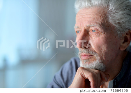 Close up portrait of thoughtful senior man Close up portrait of thoughtful senior man 71664596