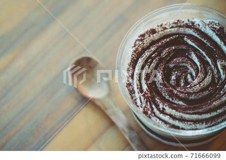 tiramisu cake on wood background. tiramisu cake on wood background. 71666099