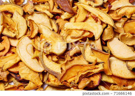 dried apple slices, dried fruit chips texture background, closeup. healthy food dried apple slices, dried fruit chips texture background, closeup. healthy food 71666146