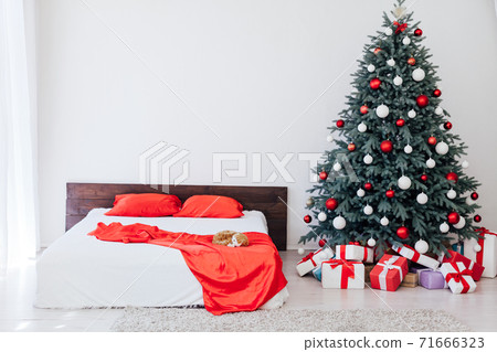 Christmas tree with gift decor bedroom with bed new year feast winter background Christmas tree with gift decor bedroom with bed new year feast winter background 71666323