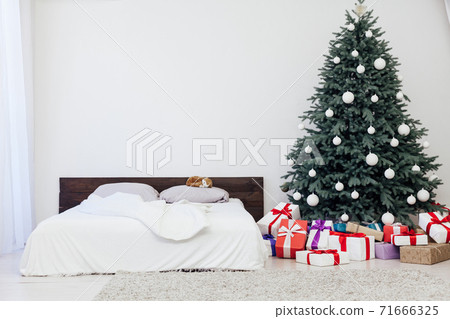Christmas tree with gift decor bedroom with bed new year feast winter background Christmas tree with gift decor bedroom with bed new year feast winter background 71666325