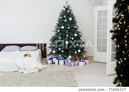 Christmas tree with gift decor bedroom with bed new year feast winter background Christmas tree with gift decor bedroom with bed new year feast winter background 71666327