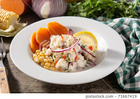 Traditional peruvian ceviche with fish, sweet potato, corn and vegetables Traditional peruvian ceviche with fish, sweet potato, corn and vegetables 71667419
