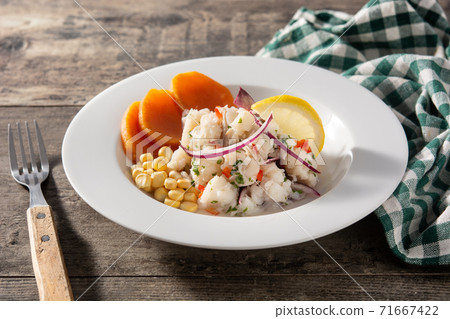 Traditional peruvian ceviche with fish, sweet potato, corn and vegetables 71667422