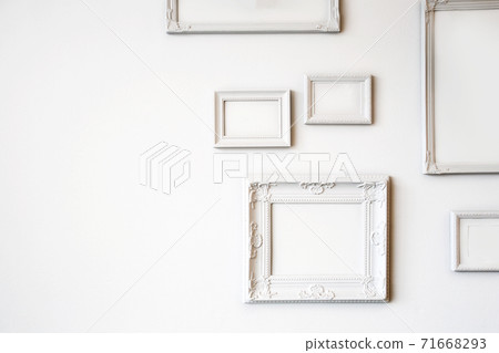 White various antique blank photo or picture frames on the white wall modern design, minimal interior design, copy space or space for text White various antique blank photo or picture frames on the white wall modern design, minimal interior design, copy space or space for text 71668293