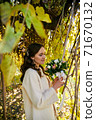 Warm autumn portrait of young pretty woman. 71670132