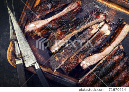 Barbecue veal spare ribs St Louis cut with hot honey chili marinade sliced Barbecue veal spare ribs St Louis cut with hot honey chili marinade sliced 71670614
